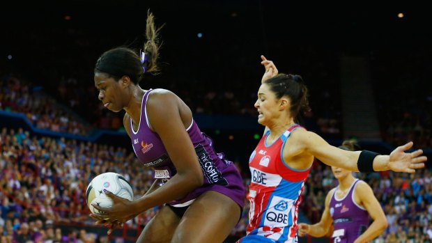 Firebirds' Romelda Aiken in action with Sharni Layton.