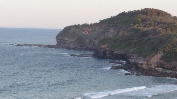 Cliff fall: a rescue helicopter arrives at Warriewood Beach.