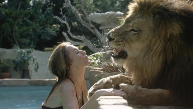 Tippi Hedren gets very close to a lion in Roar.