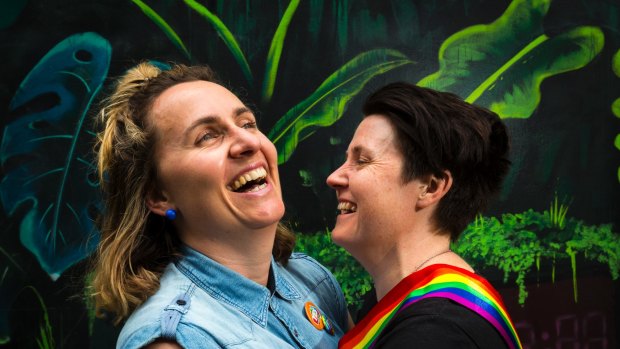 Zoe McDonald and Katie Larsen celebrate the "yes" vote at the State Library in Melbourne. 