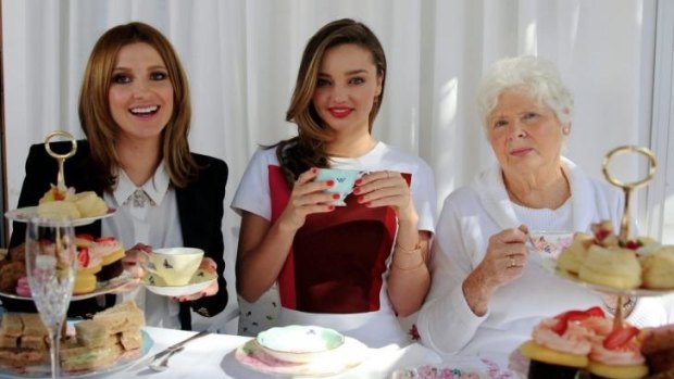 Family affair: Miranda Kerr, centre, and her grandmother Anna Kerr at high tea with Kate Waterhouse.