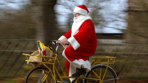 On your bike Santa ... Dr Nathan Grills would like to see Father Christmas provide a healthier role model for children.
