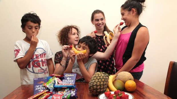 Jodie Weerasakera, with children Kean, 10, Kyren, 6, friend Ruby, 11, and Kiara, 11, says there are healthier ways to raise money for schools than junk food fund-raisers.