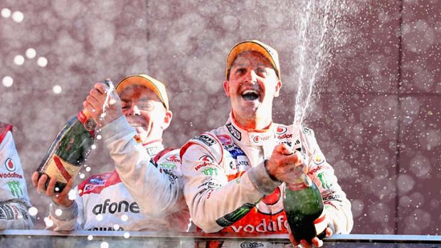 Jamie Whincup (right) celebrates after he and Paul Dumbrell (not pictured) won the Bathurst 1000.