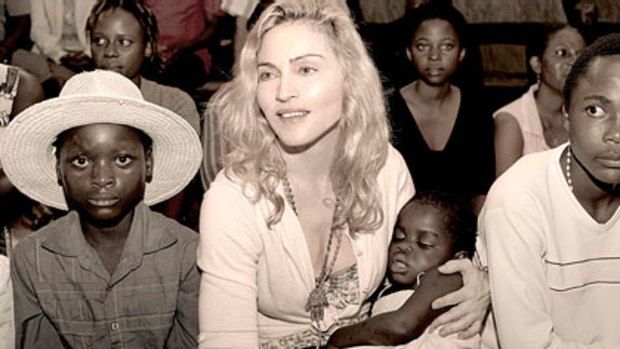 Madonna holds Mercy, the girl she hopes to adopt from Malawi.