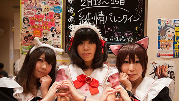 Young employees at a Meido cafe in Osaka, Japan.