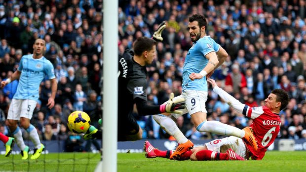 Alvaro Negredo of Manchester City scores his team's second goal.