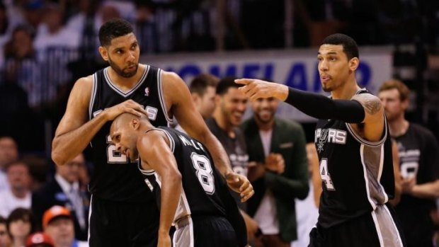 Tim Duncan, Patty Mills, and Danny Green celebrate the game six win over the Thunder.