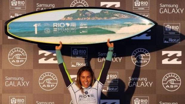 Reign in Rio ... Sally Fitzgibbons celebrates on the podium after winning the Rio Women's Pro title.   