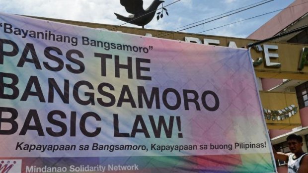 A banner supporting the passing of the law giving autonomy to Muslims on Mindanao.