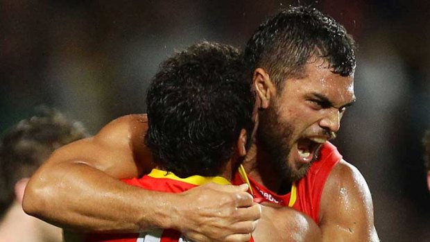 Karmichael Hunt celebrates his match-winning goal after the final siren during the Gold Coast Suns' match against Richmond in Cairns.