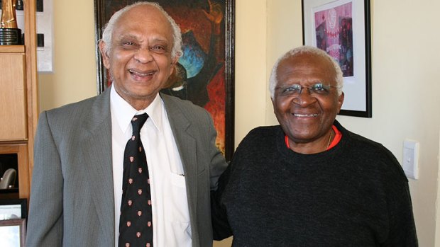 Brisbane human rights activist Brian Senewiratne pictured with South Africa’s Archbishop Desmond Tutu.