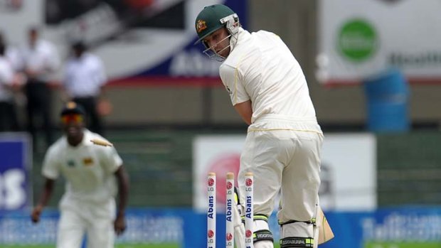 Facing the chop &#8230; Phillip Hughes plays the ball onto his stumps for a second-ball duck in the third Test at Colombo.