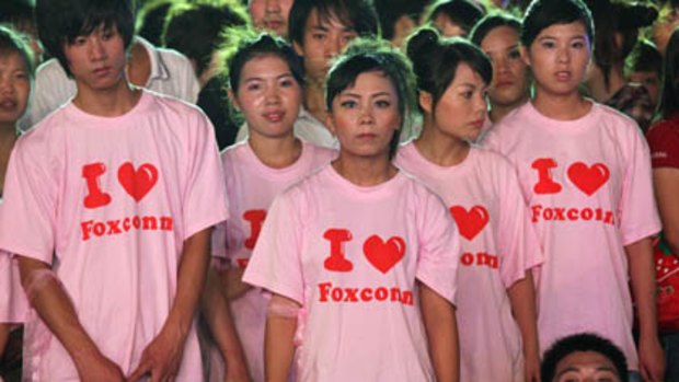 Foxconn employees attend a rally at the Foxconn campus in the southern Chinese city of Shenzhen.