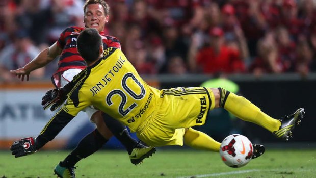 Opportunity: Brendon Santalab evades Sydney FC keeper Vedran Janjetovic to score for the Wanderers on Saturday night.