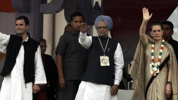 India's Prime Minister Manmohan Singh  is flanked by Rahul and Sonia Gandhi  at a rally in Delhi on Sunday to drum up support for the contentious opening up of the country's retail sector to foreign chains.