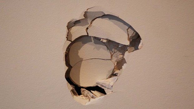 The state of the wall in the coach's box after Alastair Clarkson gave vent to his feelings.