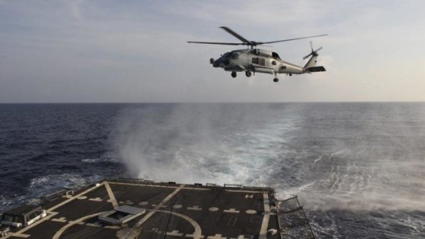 A US Navy Seahawk helicopter takes off from the USS Pinckney in the Gulf of Thailand to assist in the search.