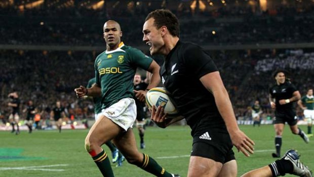 Israel Dagg of the All Blacks streaks away to score thematch-winning try.