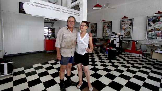 Gary and Denise Morris will be doing it all again after their Eagle Street Cafe on Patrick Street, Laidley, was hit by flooding in 2011 and now in 2013. They're cleaning up after floods devastated the town on Sunday.