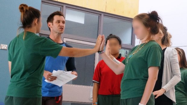 Bell Shakespeare Company's Paul Reichstein teaches drama to girls from the Juniperina Juvenile Justice Centre.