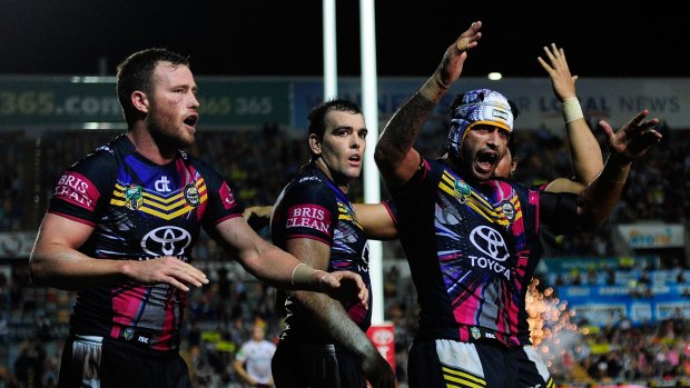 On a roll: North Queensland Cowboys players celebrate after Gavin Cooper scored the winning try against the Manly Sea Eagles on Saturday in Townsville.