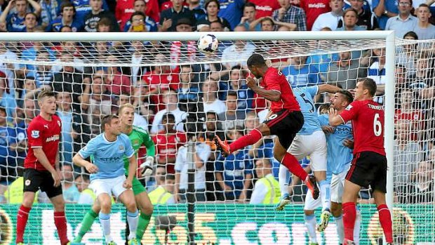The winner: Fraizer Campbell heads home Cardiff City's third goal against Manchester City.