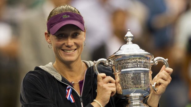 All smiles ... Samantha Stosur of Australia holds her trophy after her women's finals match against Serena Williams of the US at the 2011 US Open.