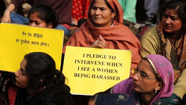 Time for action ... Indian activists hold placards during a protest against the gang rape and murder of a student in New Delhi.