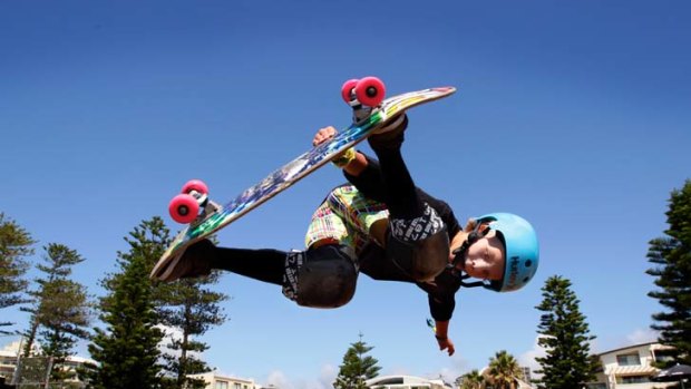 Little man, big air ... Keegan Palmer from Currumbin in Queensland gets in some jumps before the weekend at the Australian Open of Surfing bowl in Manly.