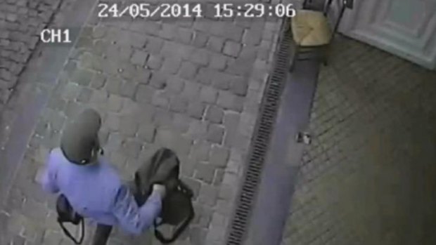 The man believed to be responsible for an attack on a Brussels Jewish museum is captured on CCTV leaving the museum.