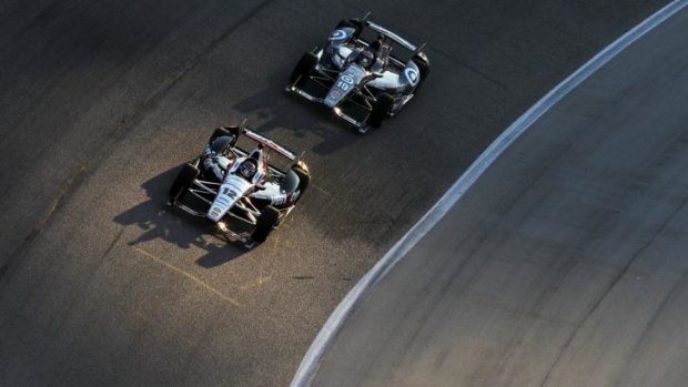 Strong start: Will Power leads Tony Kanaan at Texas Motor Speedway.