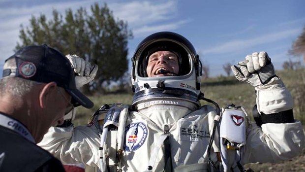 Felix Baumgartner celebrates after the second manned test flight in July.