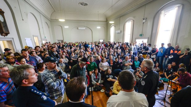 Officials front angry locals at a community meeting in Lancefield.