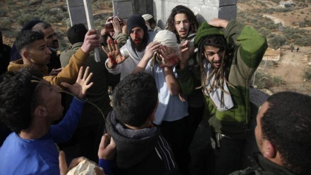 Confrontation: The Israelis fled to a house under construction near Qusra, where they were beaten.