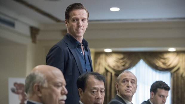 Damian Lewis (standing) plays Wall Street hedge fund titan Bobby "Axe" Axelrod in Billions.