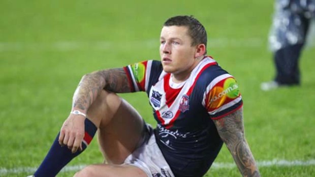 Hurt and desolate . . . but Todd Carney could play for Australia if his right knee passes muster.