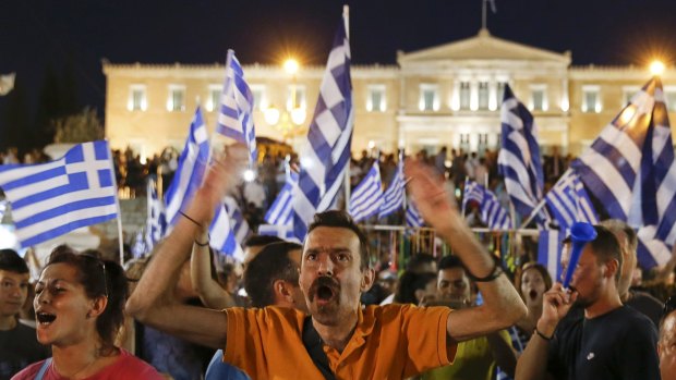 Anti-austerity 'No' voters celebrate in front of the Greek parliament in Syntagma Square in Athens.