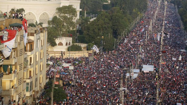 Protesters opposing Egyptian President Mohamed Morsi fill the streets in front of El-Thadiya presidential palace in Cairo on June 30.