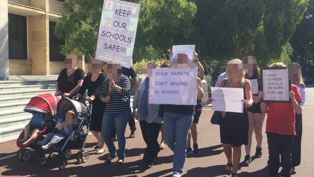 Parents protesting about convicted child sex offenders being allowed to return to school. 