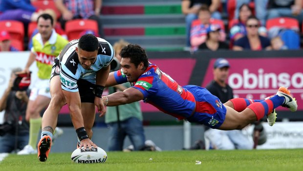 Rout: Valentine Holmes scores yet another try for the Sharks in their 62-0 demolition of the Knights at Hunter Stadium in May.