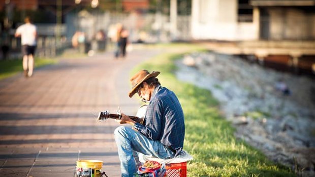 A busker by the Mississippi River in New Orleans.