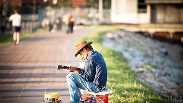 A busker by the Mississippi River in New Orleans.