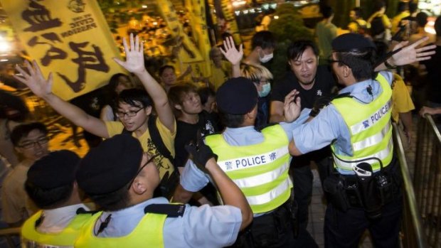 Pro-democracy activists clash with police outside the hotel where top Communist Party official Li Fei was staying in Hong Kong on September 1.