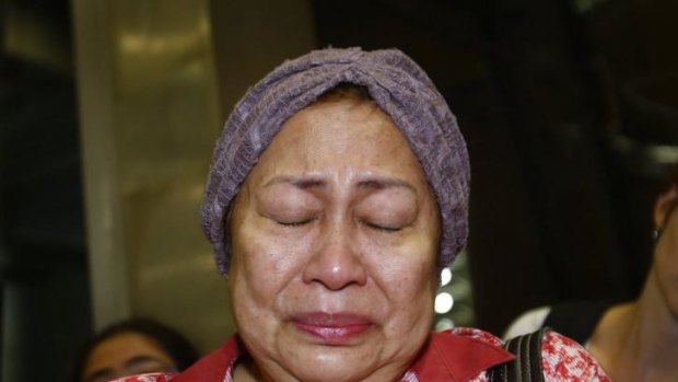A woman, who said she believed her relative was on Malaysia Airlines flight MH17, cries as she waits for more information about the crashed plane.