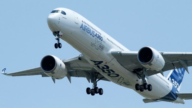 The new Airbus A350 flies over Toulouse-Blagnac airport during its maiden flight in southwestern France, on June 14.