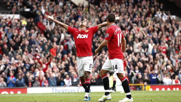 Manchester United's Nani, left, celebrates with team mate Javier Hernandez after scoring a goal against Arsenal.