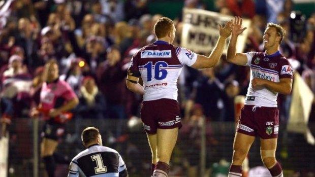 Tonic: Daly Cherry-Evans (right) congratulates Tom Symonds on a try against the Sharks.