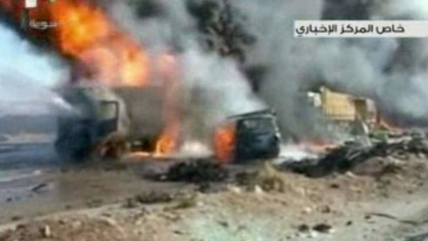 The aftermath of a truck bomb attack in Hama, Syria, which left as many as 30 people dead.