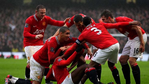 Party time: Manchester United players celebrate their second goal.